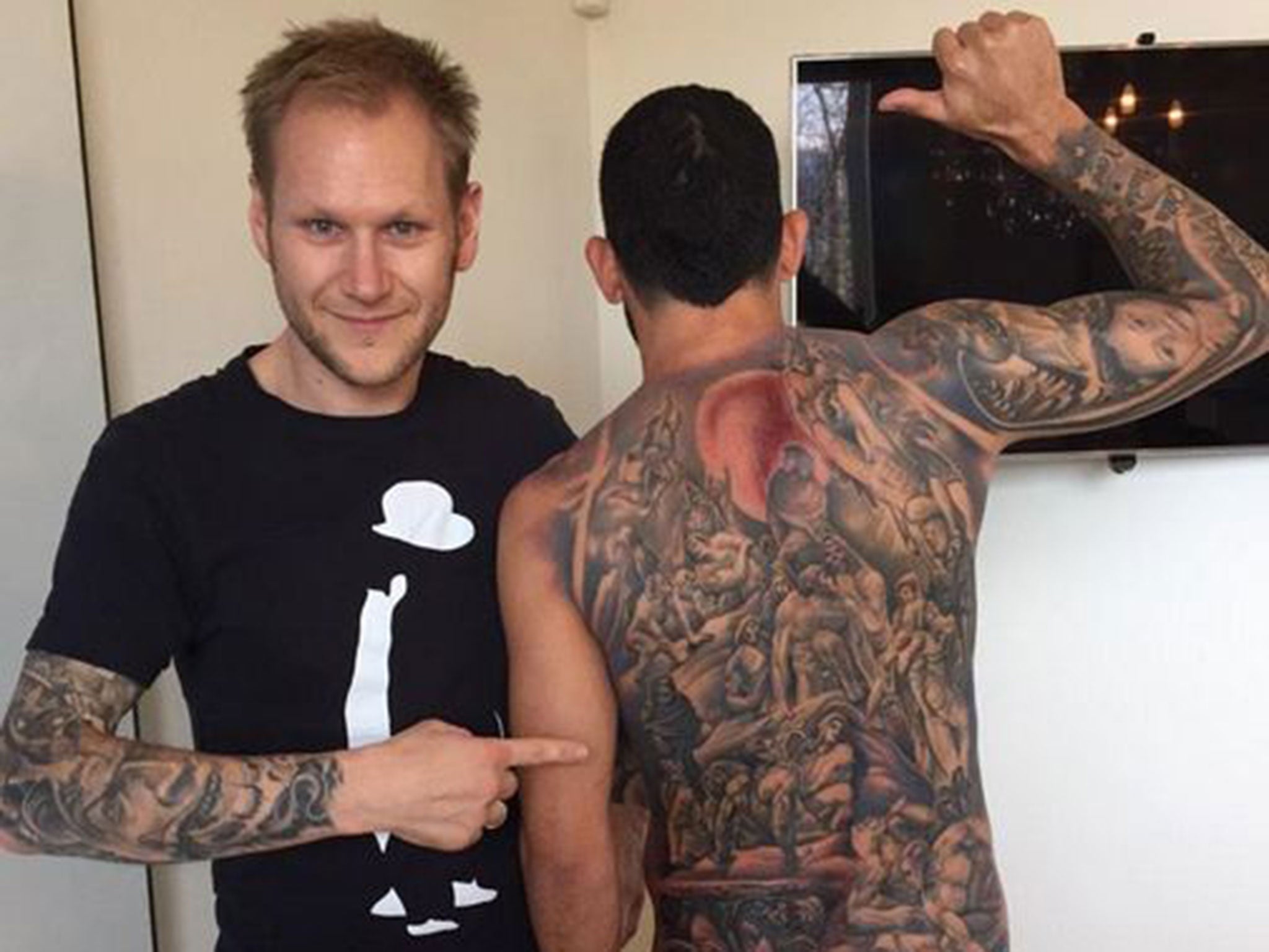 Carlos tevez back tattoo